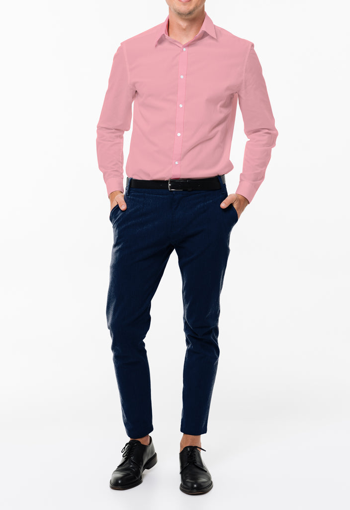 man walking down street wearing pink blazer over blue shirt with navy pants   AvenueSixty